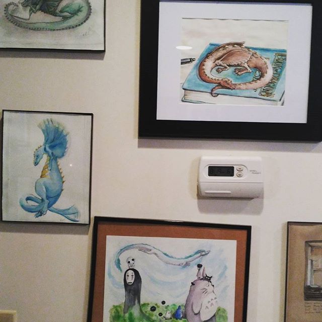 Busy cooking and cleaning today so you get more of my #paintings  framed and hung. And our thermostat. (Ghibli Spirits painting kept falling down and is still crooked). All of these pieces are currently available on my Etsy shop: https://www.etsy.com/shop/tinyBookDragonArt?ref=ss_profile #art #Watercolor #Dragon #dragonbook #dragonart #studioghibli #framing #spiritedaway #totoro #sootsprites #artist #illustration